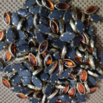 8K Eye Orange Colour Glossy Kundans